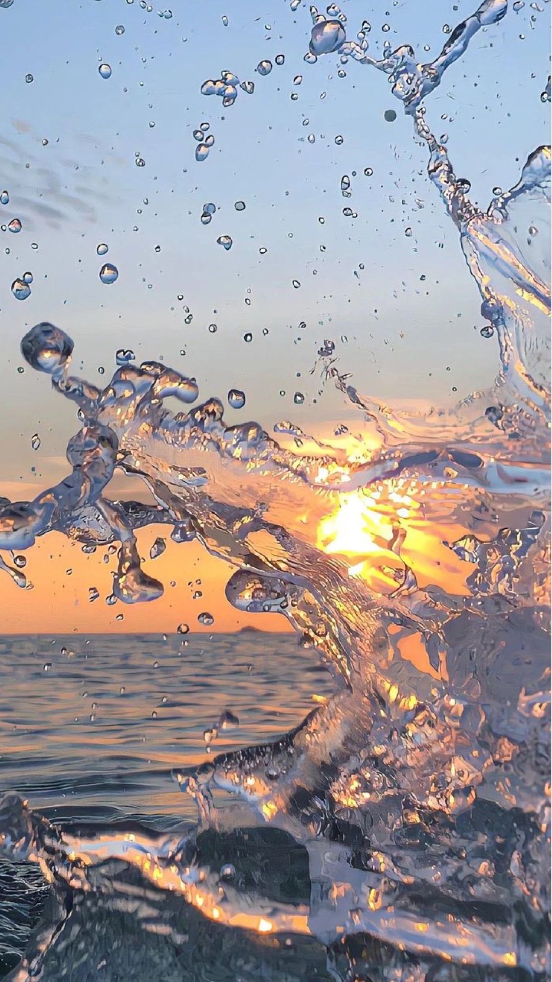Ocean Sunset with Splashing Waves Download Wallpapers
